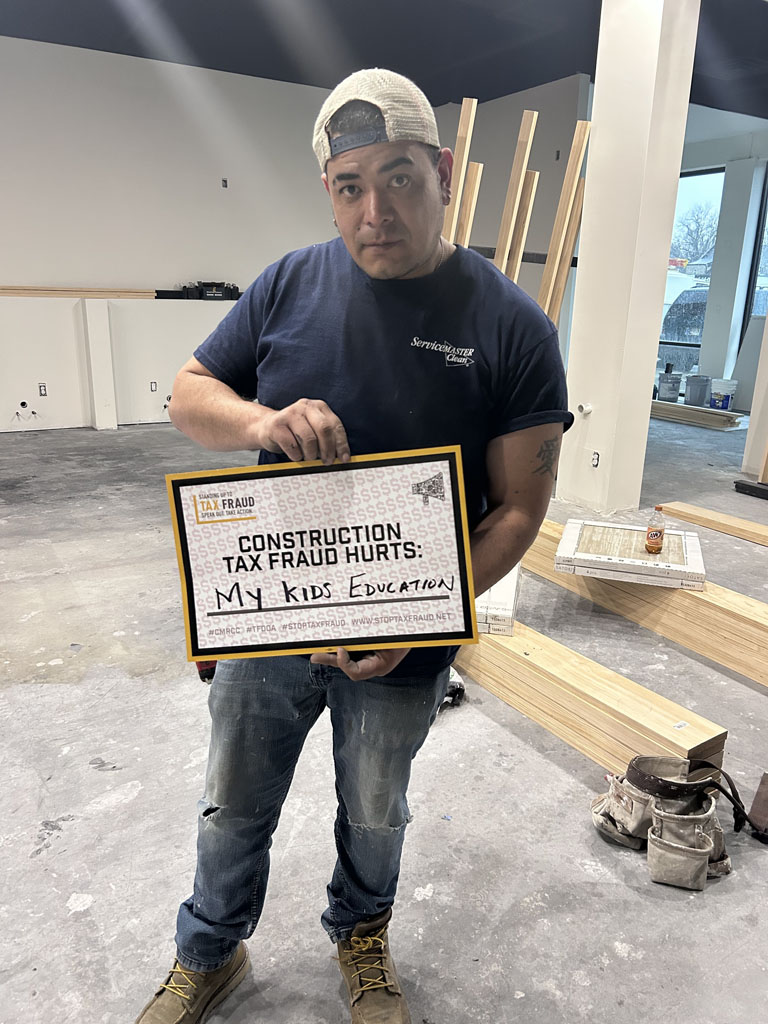 A Servicemaster worker stands up in the Central Midwest