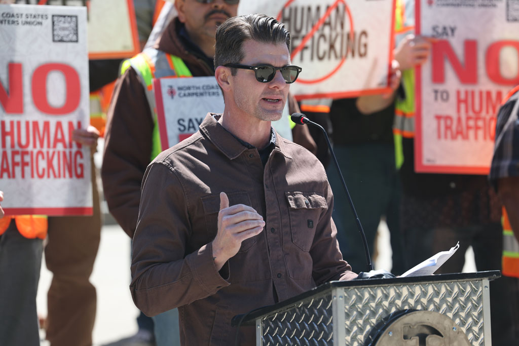 A contractor speaks out as Allied Framers official Jesse Carter addresses Sacramento rally