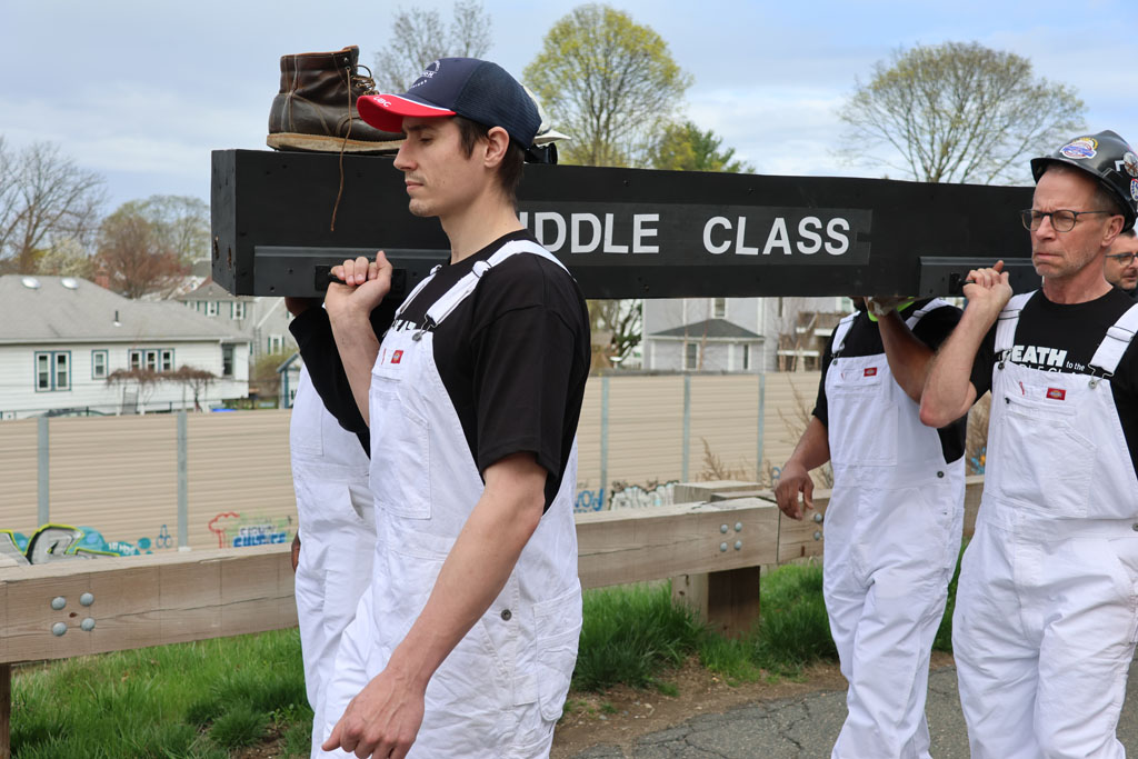 At Tufts University in Medford, Mass., members protest Tufts' anti worker stance with a mock funeral for the middle class
