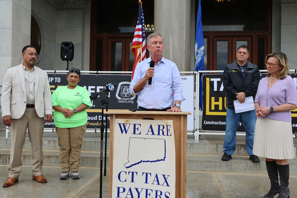 Connecticut Governor Ned Lamont speaks at a Hartford rally