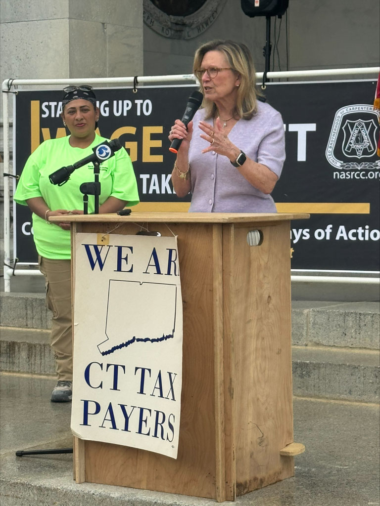 Connecticut State Senator Julie Kushner, a champion of Carpenters, and workers' rights, speaks out against tax fraud. (with Local 326 member Bella Jimenez)
