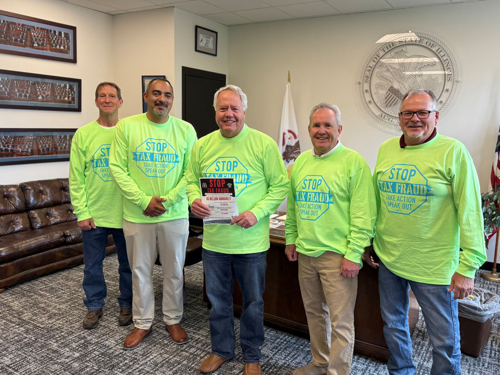Illinois House Majority Leader Jay Hoffman stands up with Mid America members