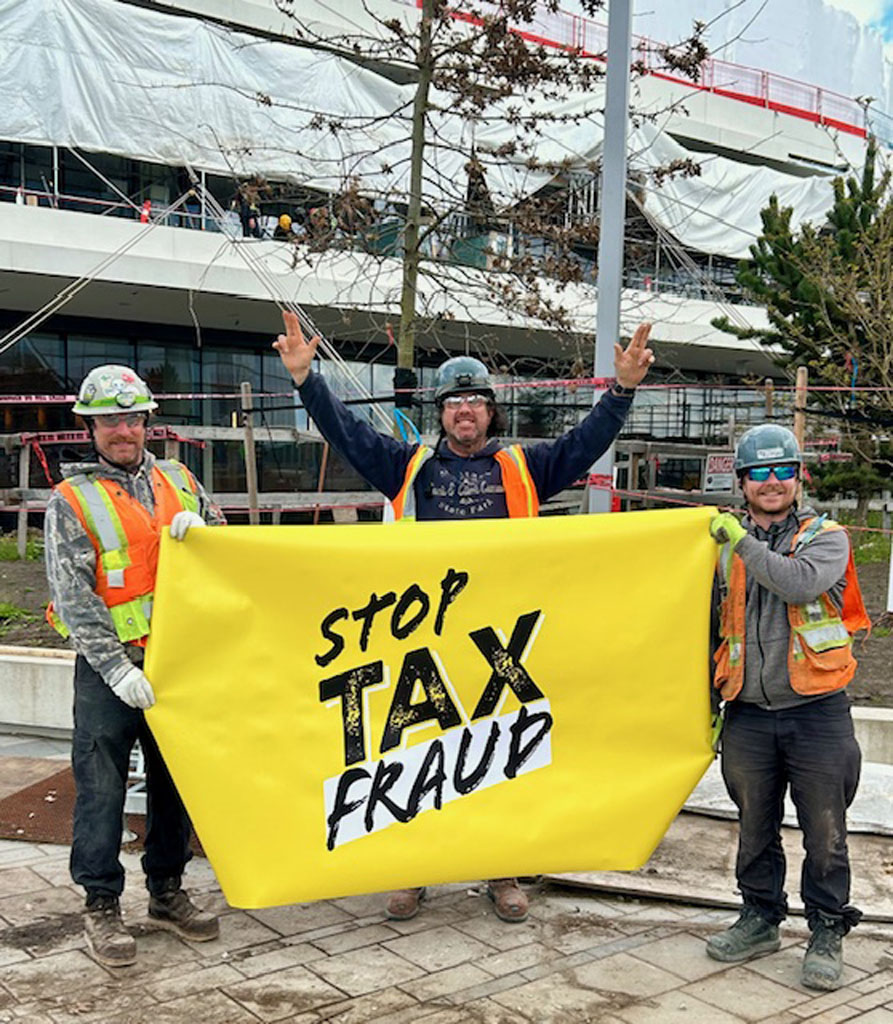In Vancouver, UBC scaffolders with Oxford Builders stand up at Oakridge Center
