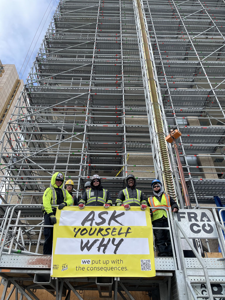In Winnipeg, members stand up at the NorthStar Evergreen Tower